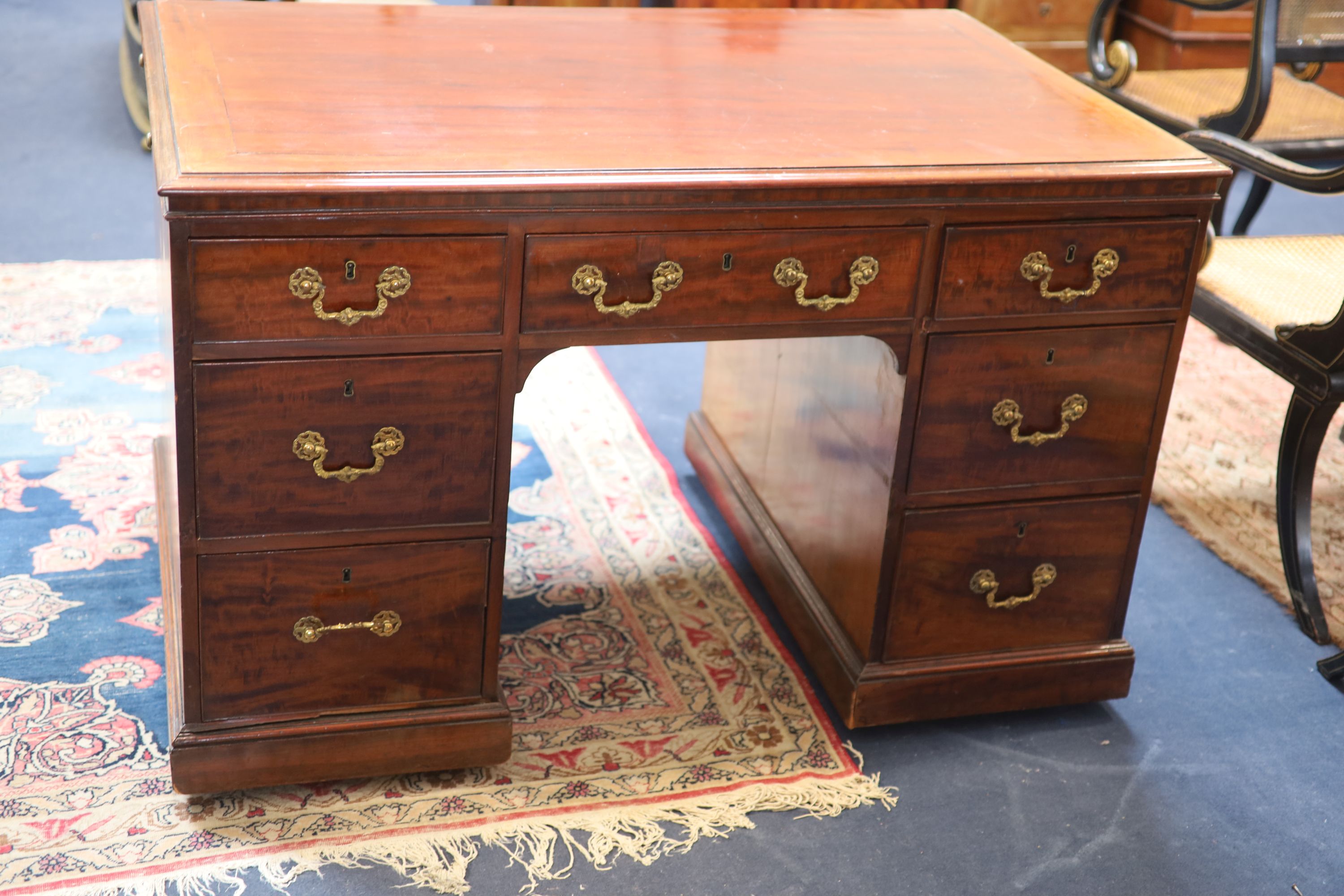 A George IV mahogany kneehole desk by William Williamson & Son of Guildford, second quarter 19th century width 125cm depth 79cm height